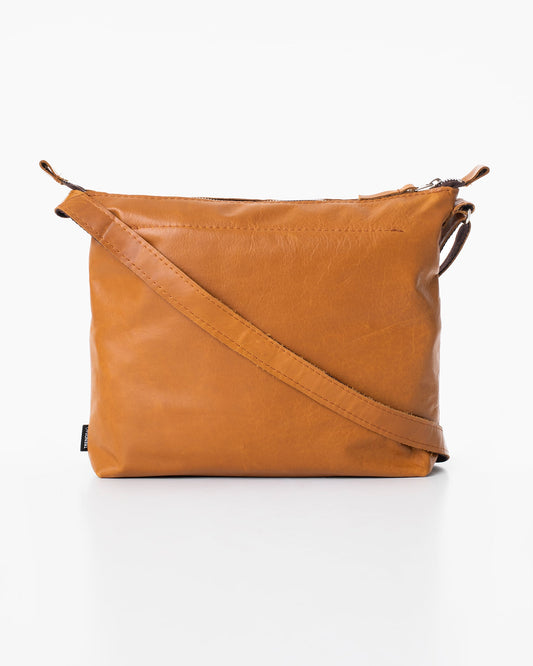 Handmade Anet L shoulder bag crafted from furniture industry leftovers, unique in design due to its one-of-a-kind materials. Made in Estonia for eco-friendly, durable style.