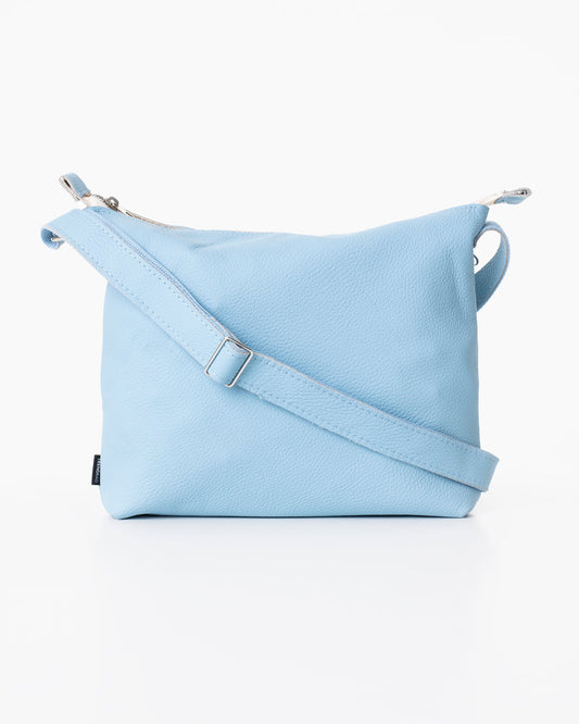 Handmade Anet L shoulder bag crafted from high-quality furniture leftovers, light blue with a strap. Eco-friendly and unique, each bag varies slightly. Made in Estonia by Trendbag.
