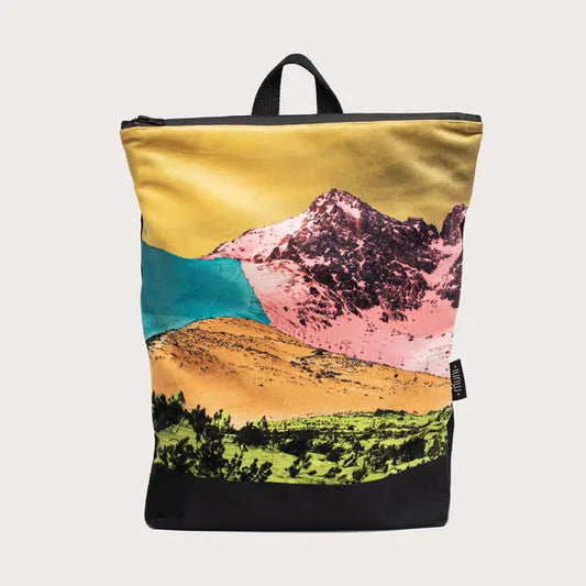 A spacious backpack featuring a bold mountain landscape design. Velvet top, waterproof polyester bottom, and adjustable straps. Zipper closure, laptop pocket. Dimensions: 44cm x 36cm.
