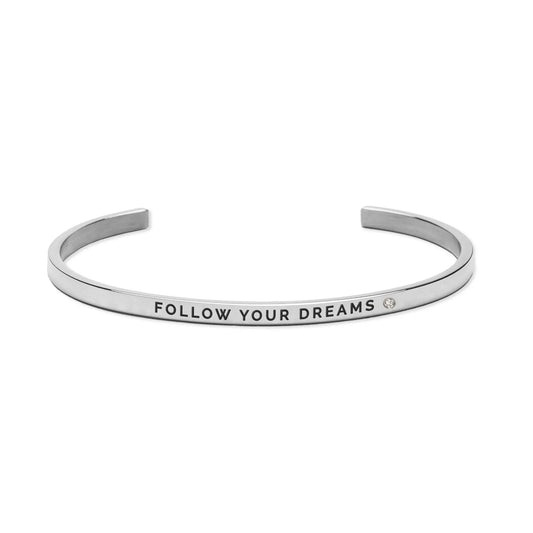 Silver bracelet with Follow Your Dreams engraved in black text. Adjustable, durable, and lightweight. Polished stainless steel. Width: 3 mm. Available in silver, rose gold, gold.