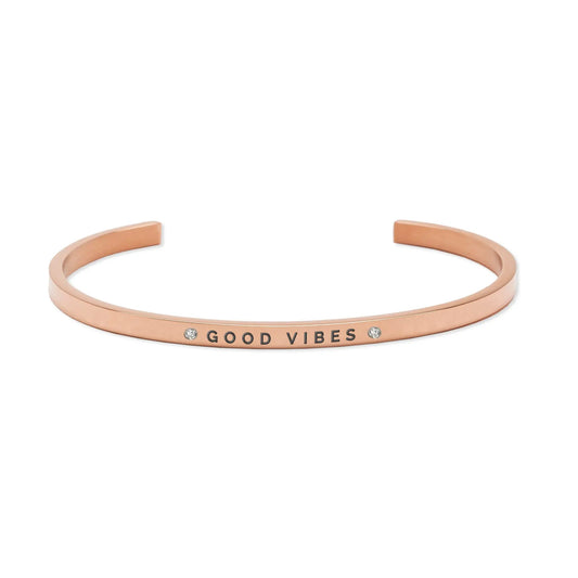 Close-up of adjustable stainless steel bracelet engraved with Good Vibes. Durable, lightweight design with 3mm width. Available in silver, rose gold, gold.