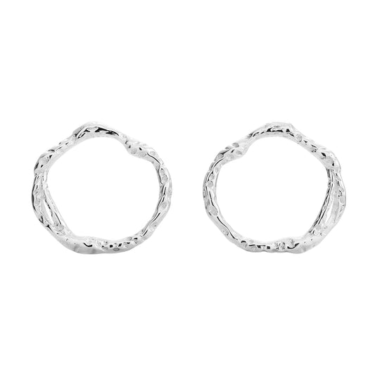 Minimalistic Echo silver stud earrings, circle-shaped. Made from recycled 925 sterling silver, hypoallergenic, and rhodium plated. Elegant, comfortable, and perfect for all occasions.