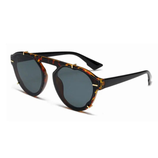 Chic MODERN Leopard sunglasses with heart-shaped frames. Polarized UV-400 protection, durable materials, and stylish design for confident outdoor style. Includes a carrying case. Designed in Europe.
