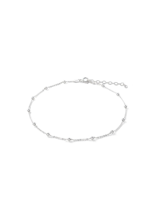 A minimalist silver anklet with chain and mini bubbles, adjustable up to 27 cm. Hand-made from sterling silver, weighing 1.62 g, with a two-year warranty.