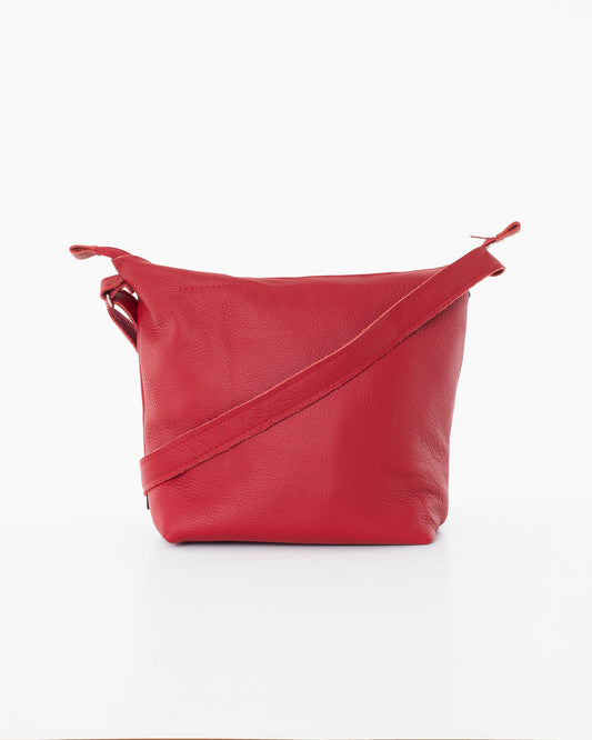 Handmade Suvi XS red leather shoulder bag with zippered compartments, crafted from furniture industry leftovers. Unique design from Estonia.