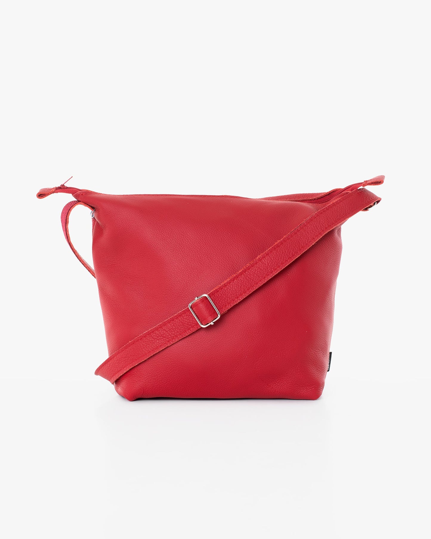 Handmade Suvi XS shoulder bag in red leather, featuring a buckle detail. Made from furniture industry leftovers, with zippered compartments. Designed and crafted in Estonia.