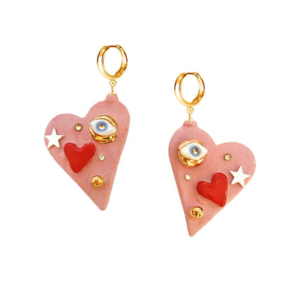 Hand-made ceramic earrings with 24K gold lustre, Eye of Protection charm, SWAROVSKI crystal, and unique details. All You Need Is Love collection.