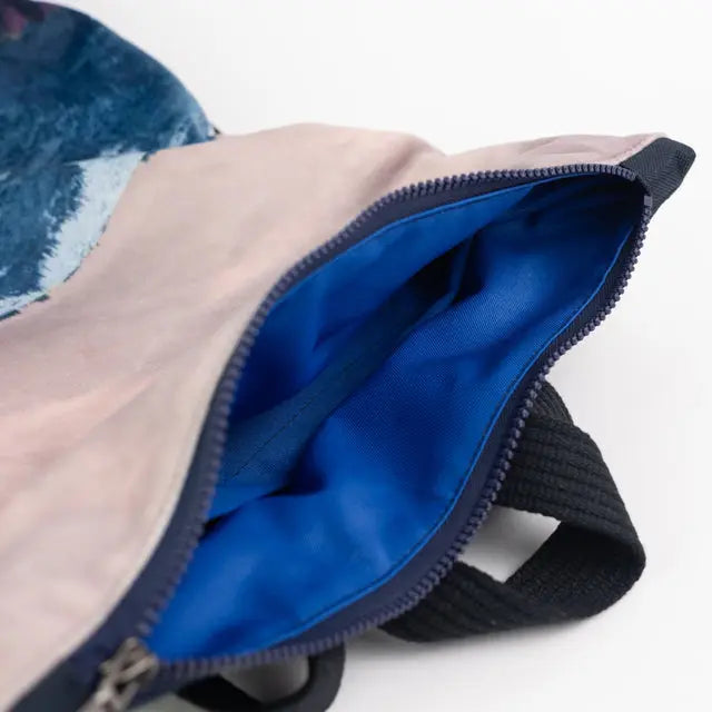 A minimalist BLUE MOUNTAINS backpack with a zipper closure. Features velvet top, waterproof navy blue bottom, and adjustable straps. Ideal for daily essentials and a 13 laptop. Dimensions: 44cm x 36cm.