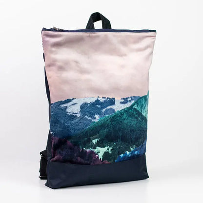 Minimalist BLUE MOUNTAINS backpack featuring a mountain design. Velvet top, navy blue bottom, adjustable straps, laptop pocket. Height: 44 cm, Width: 36 cm.