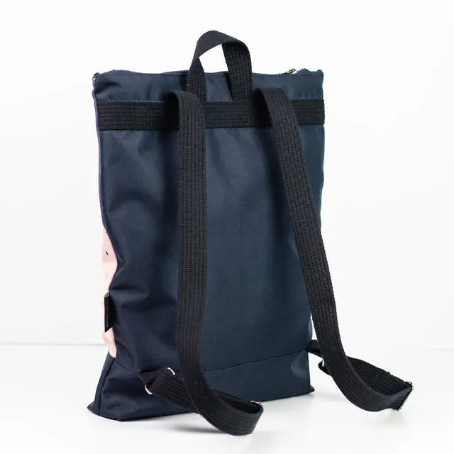 A blue backpack with black straps, featuring a velvet top with a Watercolor printed design and waterproof navy blue polyester bottom. Includes adjustable shoulder straps and compartments for a 13 laptop.