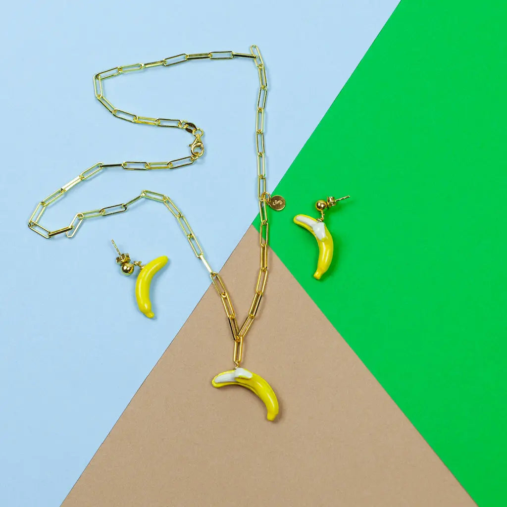 Banana Love earrings by SCULP Jewelry: Hand-made ceramic earrings with 24K gold-over 925 sterling silver details. Each unique piece reflects Tamil Nadu's royal fruit tradition.