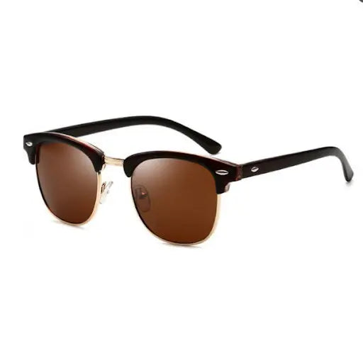 Close-up of COCO Gold Sunglasses with brown lenses, offering UV-400 protection. Stylish eyewear designed in Europe for durability and elegance, complete with a carrying case.