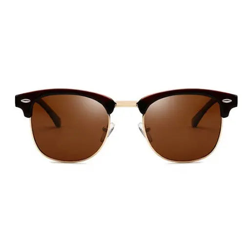 A close-up of COCO Gold Sunglasses with brown lenses, offering polarized UV-400 protection. Crafted for durability and style, designed in Europe, complete with a carrying case.