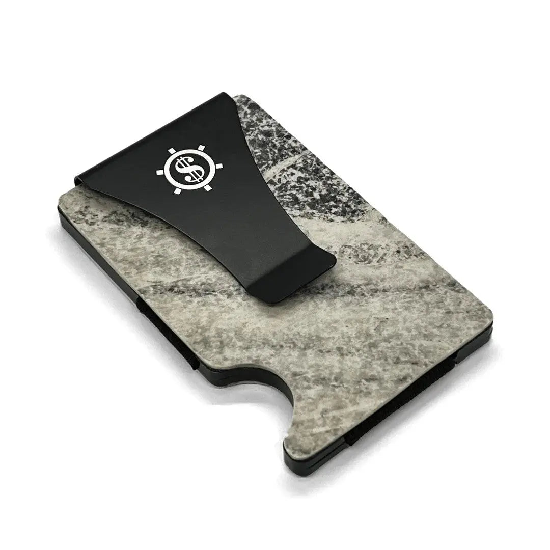 Metal cardholder with RFID blocking, made from natural marble. Holds up to 12 cards, features eco-friendly packaging. Available with or without money clip. Dimensions: 9 x 5.5 x 1.5 cm.