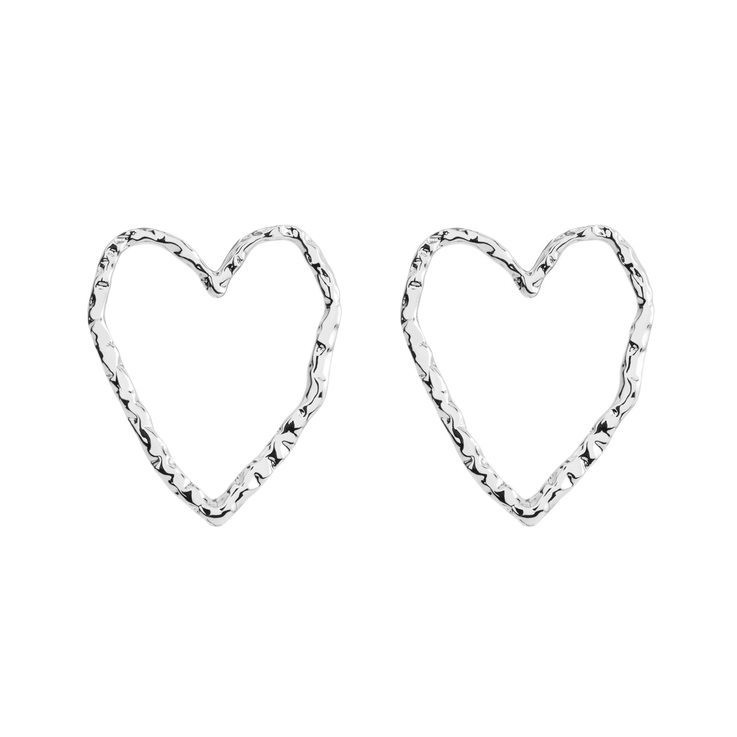 Minimalistic heart-shaped Eros silver stud earrings made from recycled silver. Hypoallergenic and comfortable for all-day wear. Materials: brass, 925 sterling silver pin, rhodium plated.