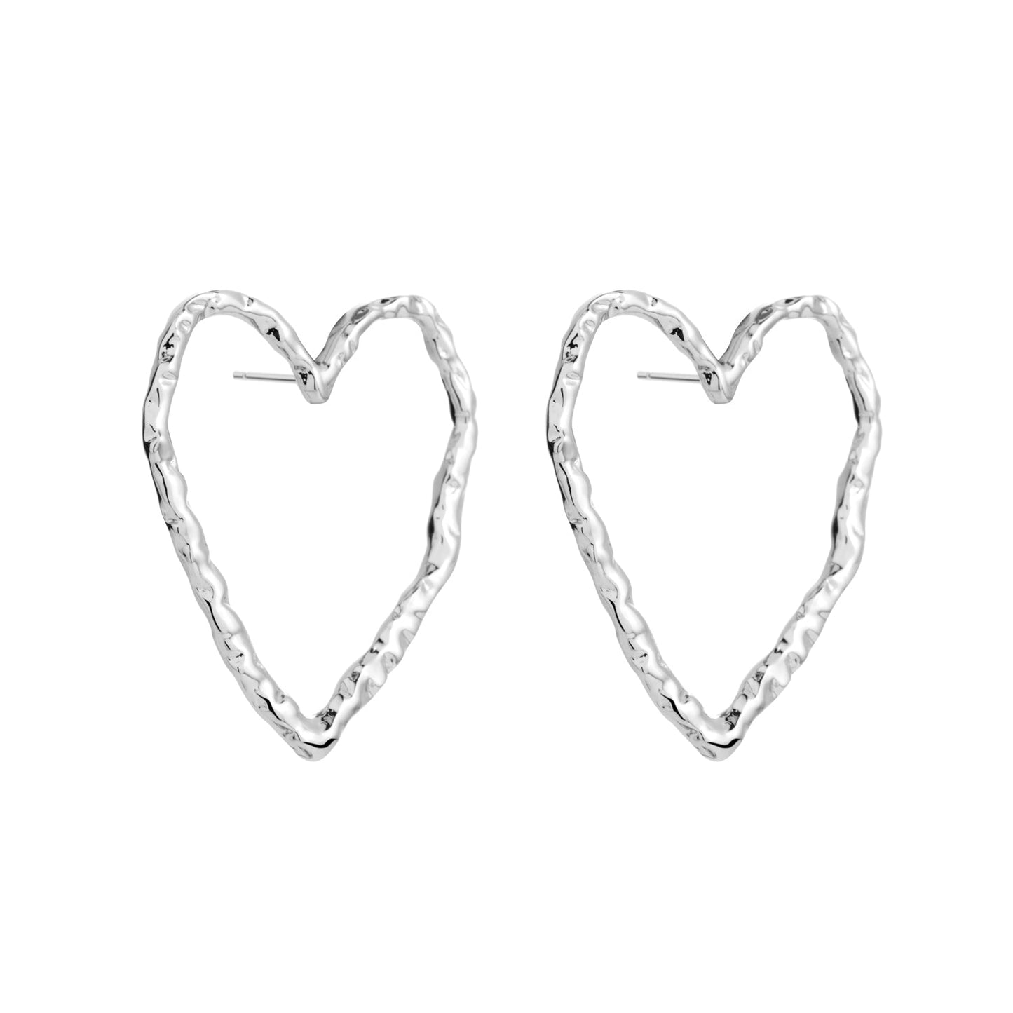 Minimalistic heart-shaped Eros silver stud earrings made from recycled silver. Hypoallergenic and comfortable for sensitive ears. Brass material with 925 sterling silver pin.