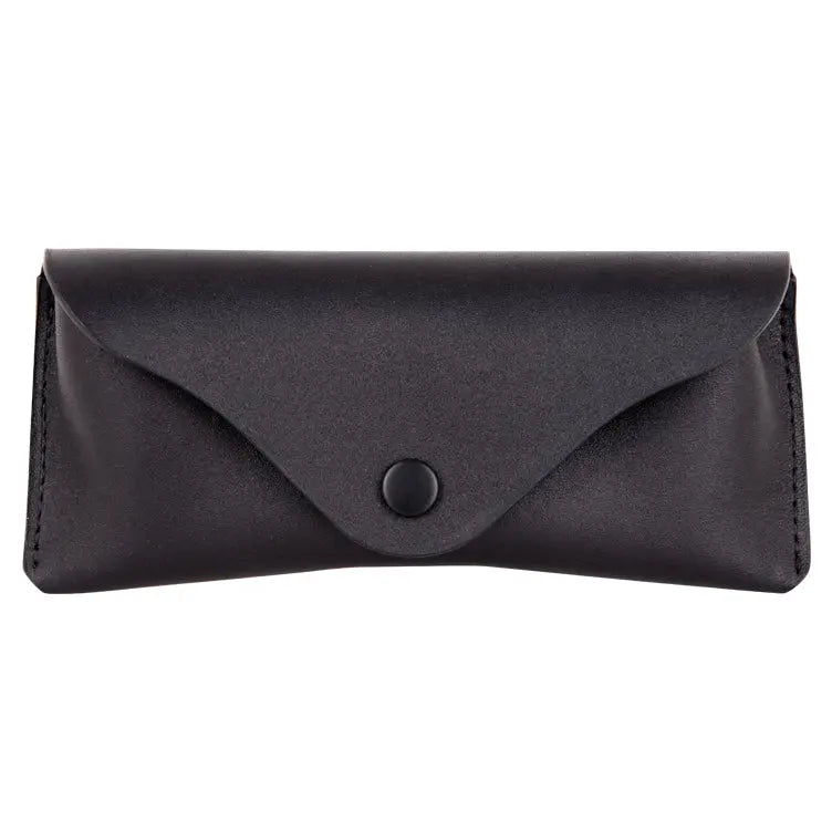 Black leather glasses case with button closure, crafted from 100% genuine leather. Fits standard eyewear sizes, compact and stylish for on-the-go use. Subtle logo detail for added sophistication.