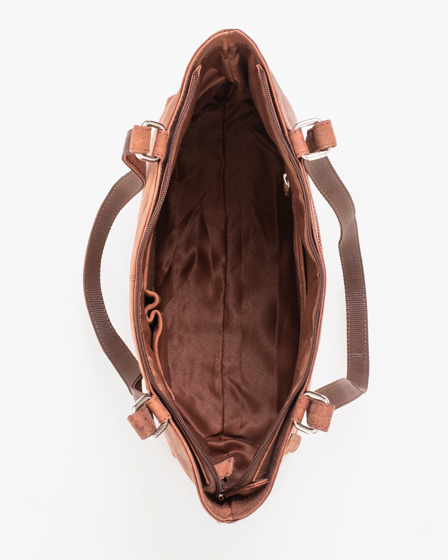 A brown leather shoulder bag with multiple zippered compartments, featuring a close-up of a buckle and detailed stitching. Dimensions: 40 x 26 x 11 cm. Made by Finnish brand Nabo.