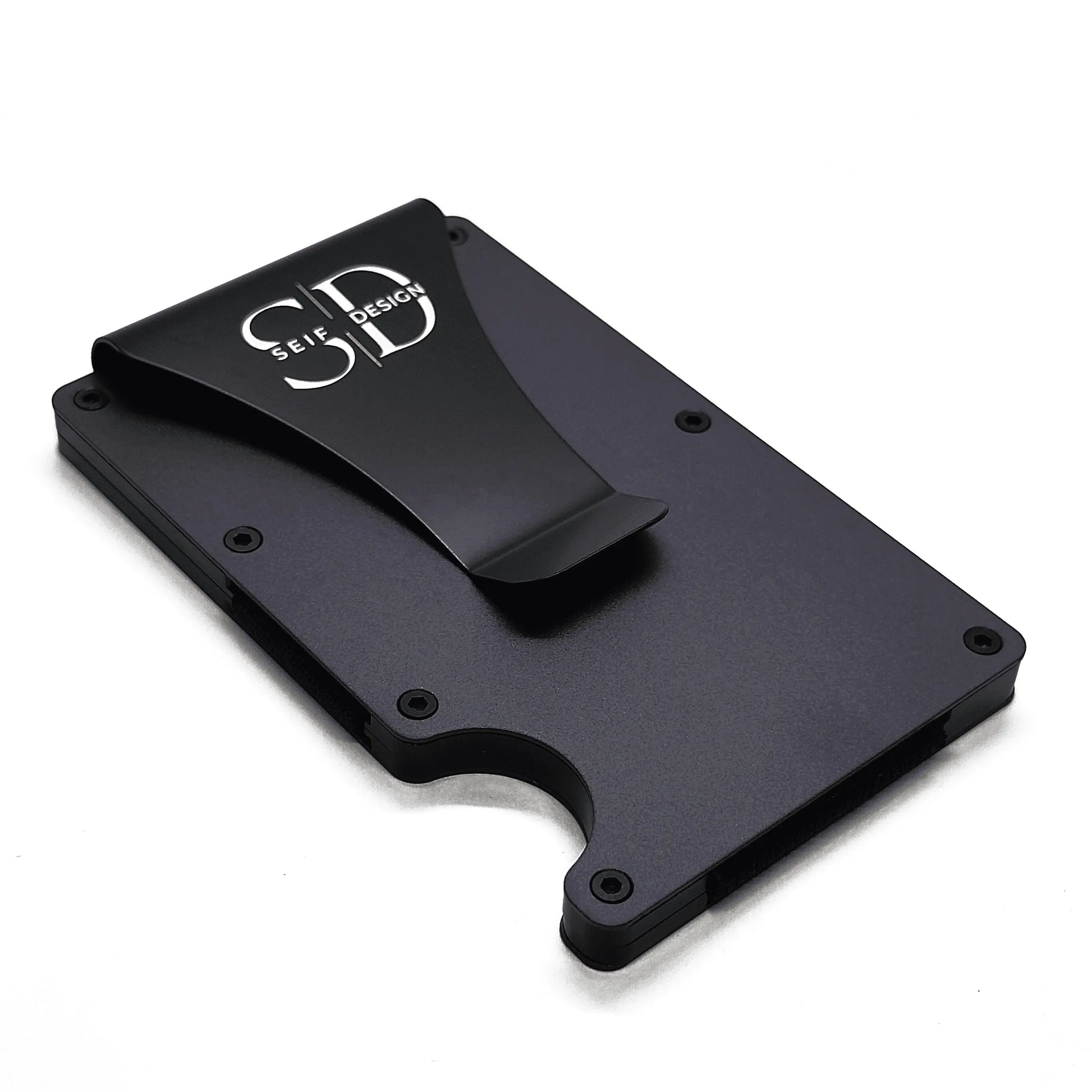 Sleek aluminum cardholder with RFID blocking, holds up to 12 cards. Logo close-up on black surface. Eco-friendly packaging. Lite Storm - Card Holder by Seif Design.