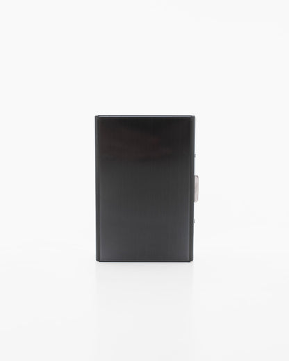 Black metal card holder by Nabo, a Finnish brand. Rectangular with 6 slots, measuring 9.5 x 6.5 x 1.2 cm. Sleek design with metal surface and lock detail.