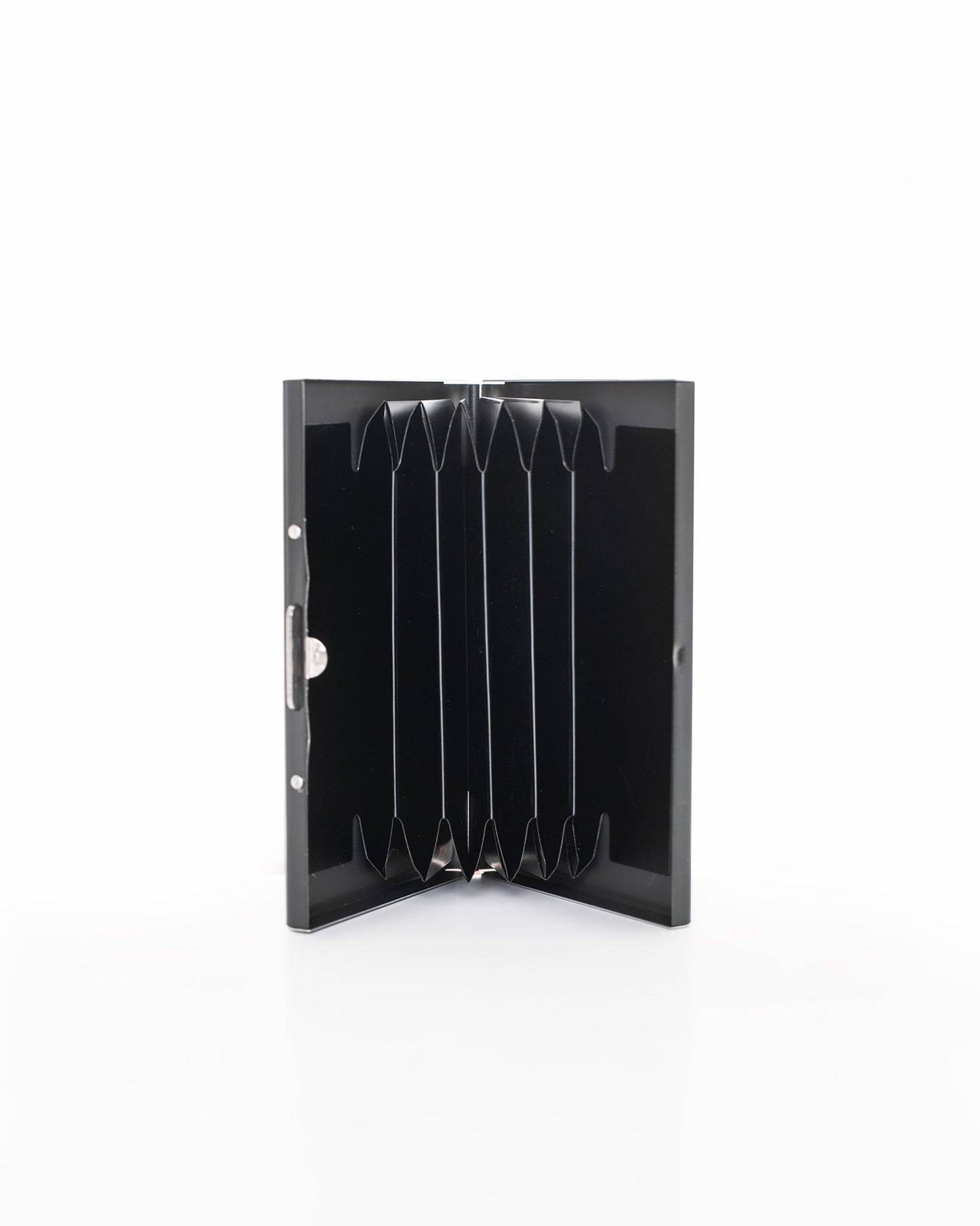 Metal Card Holder - Black by Nabo. Sleek black box with metal handle, 6 slots. Dimensions: 9.5 x 6.5 x 1.2 cm. Finnish brand known for quality bags.