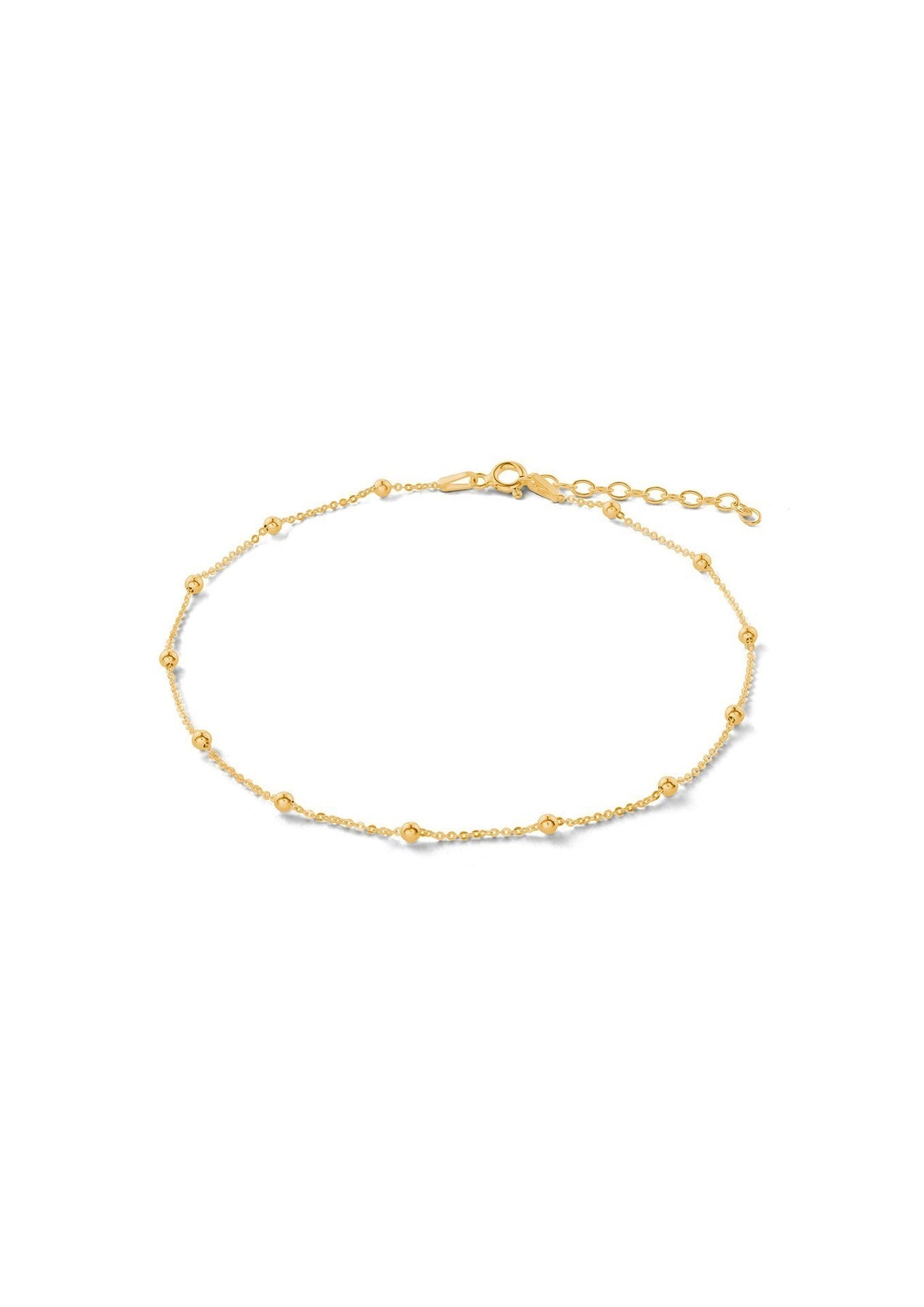 A minimal Mini Bubble Anklet in gold, featuring a silver chain with delicate bubbles. Hand-made with sterling silver coating and 24k gold plating, adjustable length, and sustainable packaging.