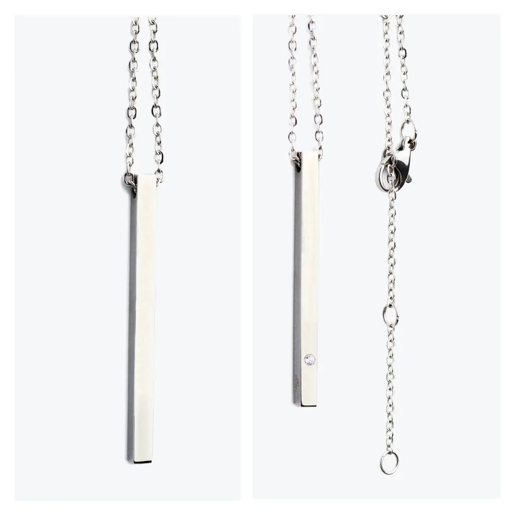 A silver bar necklace with a diamond pendant, showcasing a durable stainless steel construction. Length: 50 cm. Available in silver, rose gold, and gold.