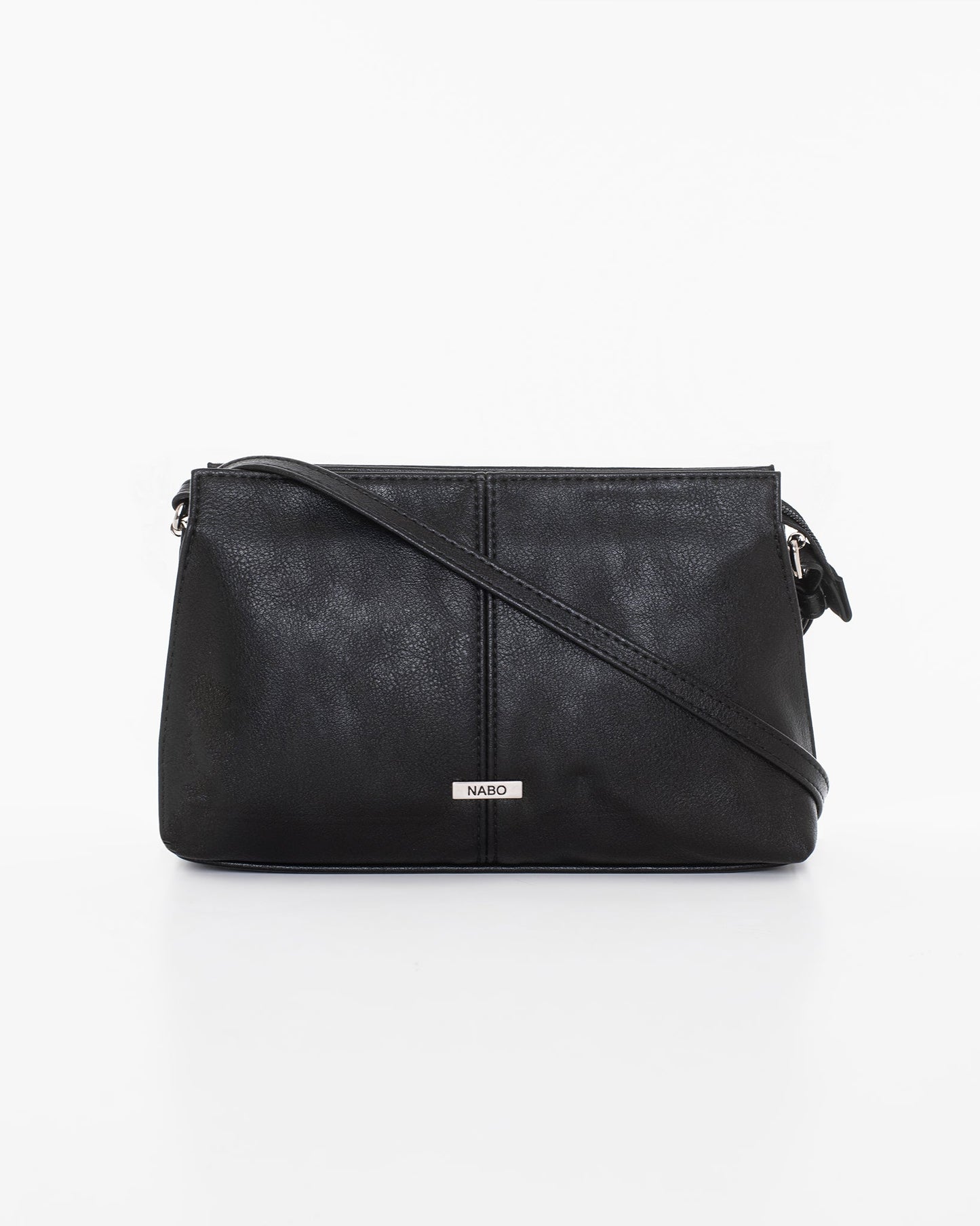 Black leather shoulder bag by Nabo, made in Finland. Features three zippered pockets and an adjustable strap up to 145 cm. Dimensions: 23 x 14 x 7 cm.