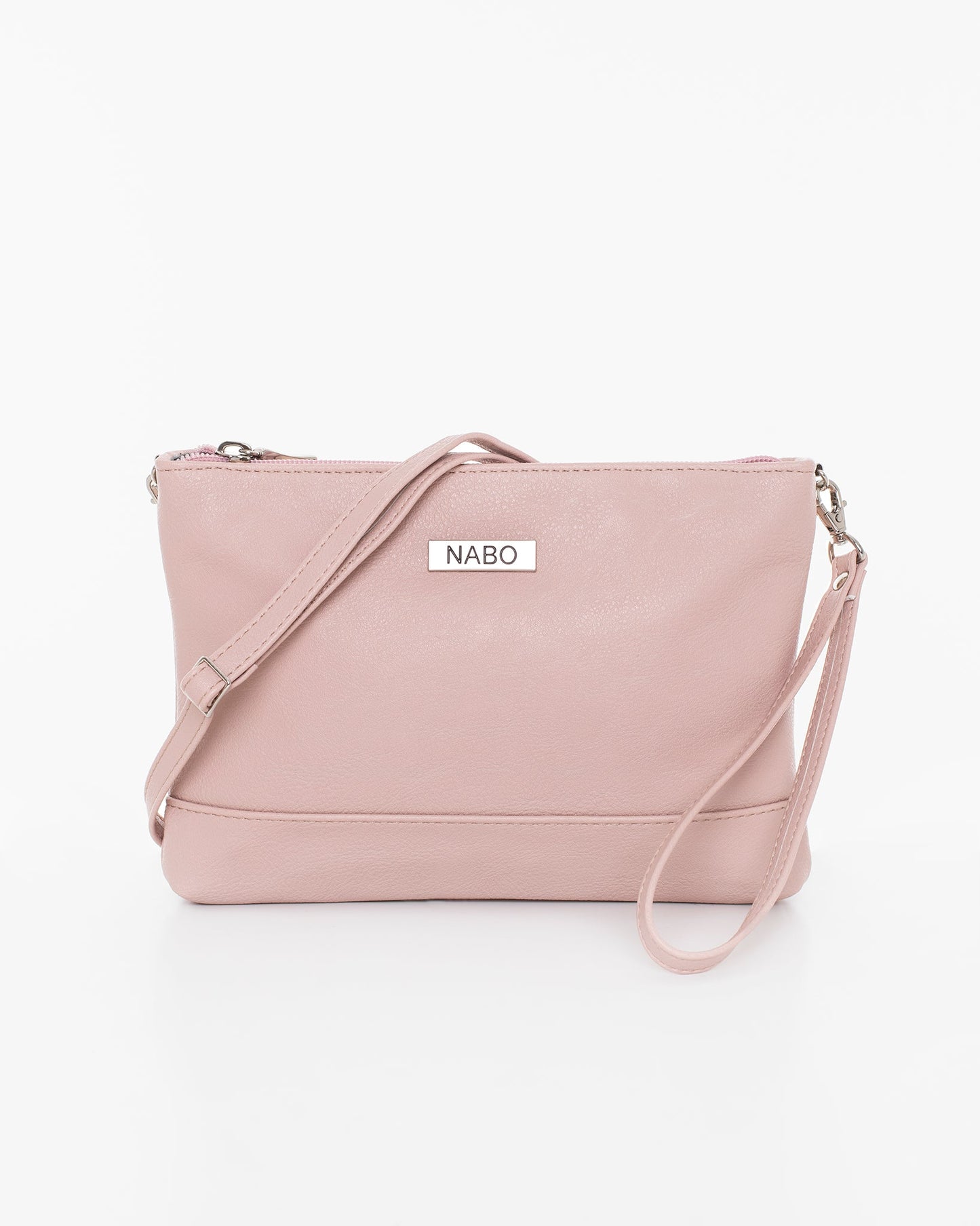 Shoulder Bag - Nude by Nabo: A pink leather purse with zippered pockets, removable shoulder and wrist straps. Dimensions: 22 x 15 x 3 cm. Made in Finland.