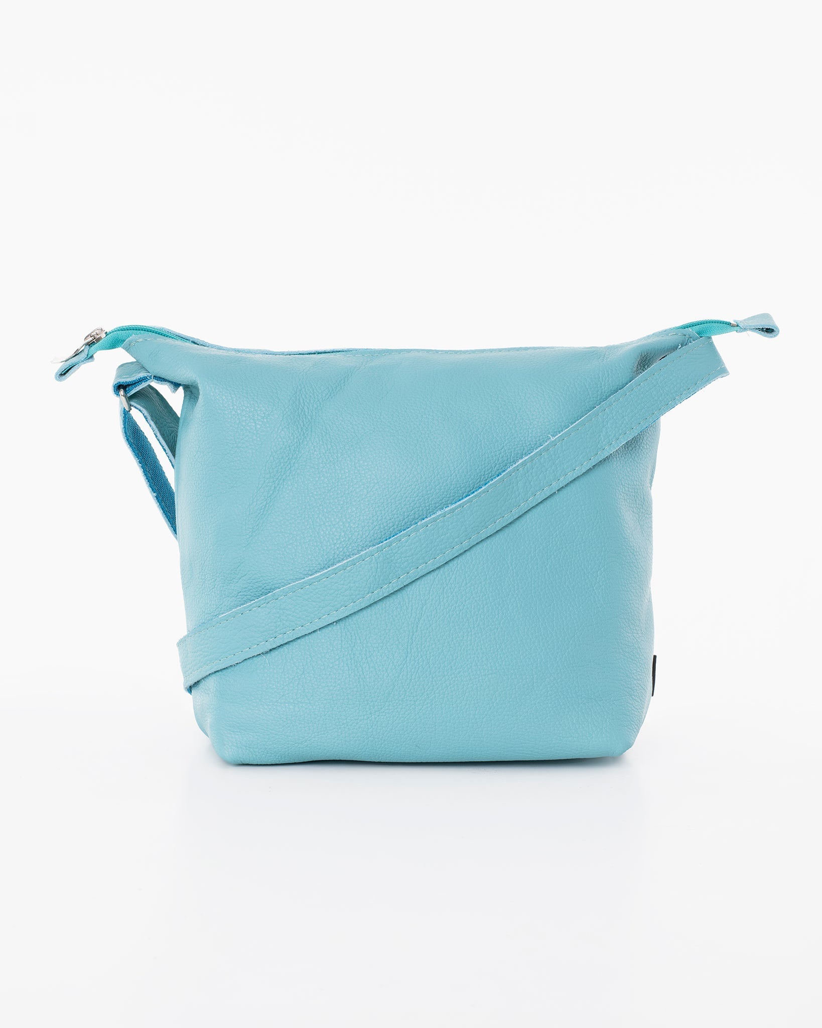Handmade Suvi XS shoulder bag crafted from blue leather, repurposed from furniture industry leftovers. Unique design, eco-friendly, and durable. Made in Estonia by Trendbag.