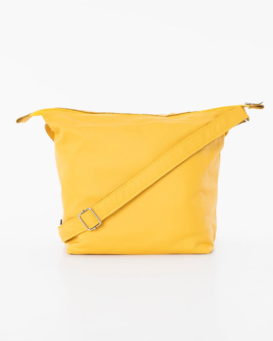 Handmade Suvi XS shoulder bag in yellow leather, repurposed from furniture leftovers. Unique design, eco-friendly, durable. Made in Estonia.