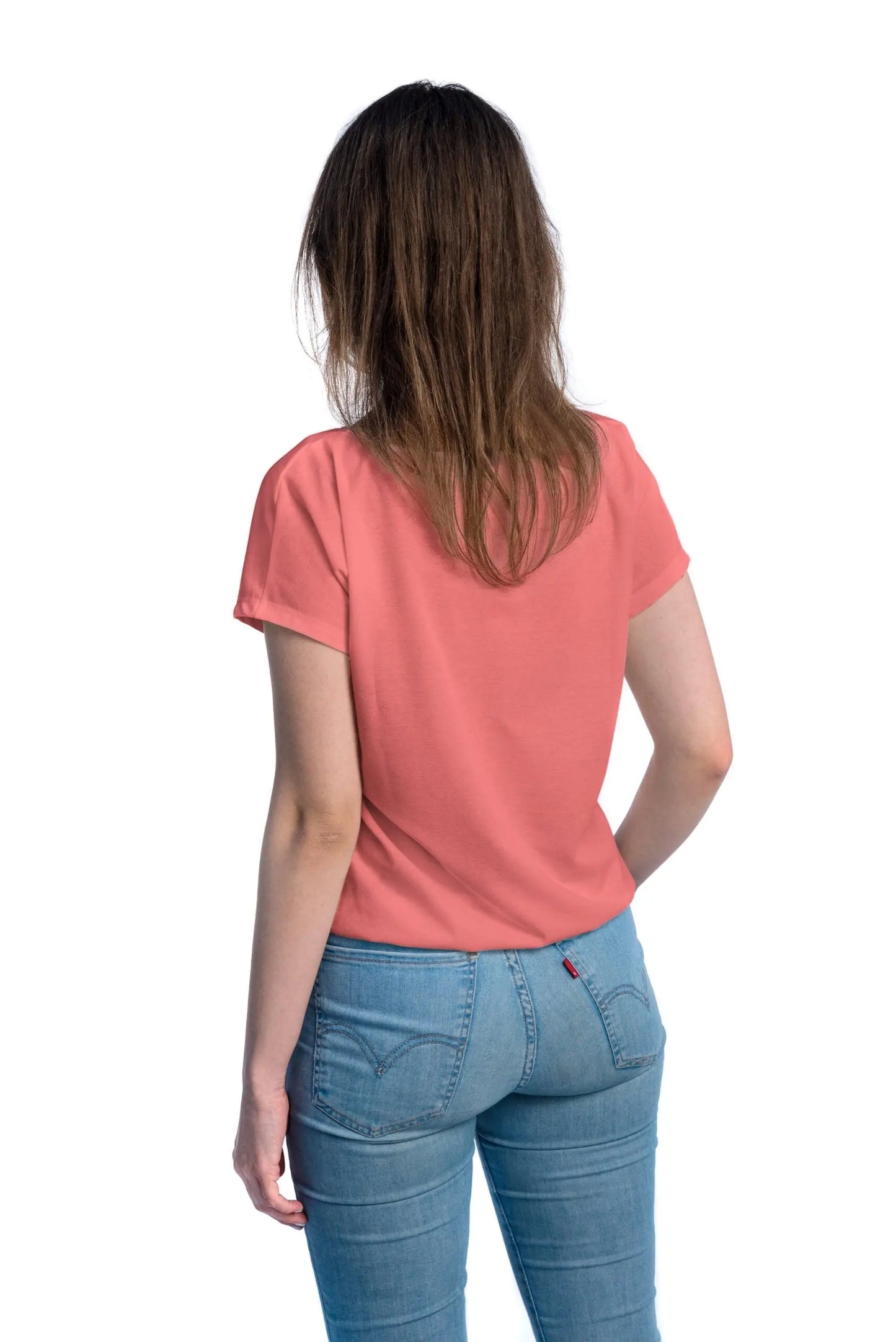 A woman in a coral Tan-Through T-Shirt, elastic band at the bottom, designed for outdoor activities, allowing healthy tanning with UVA rays passing through fabric. Sizes XS-XXL.