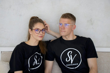 A man and woman wearing glasses, showcasing CALIFORNIA Blue Light Glasses. Designed to protect eyes from blue light, ideal for screen time.